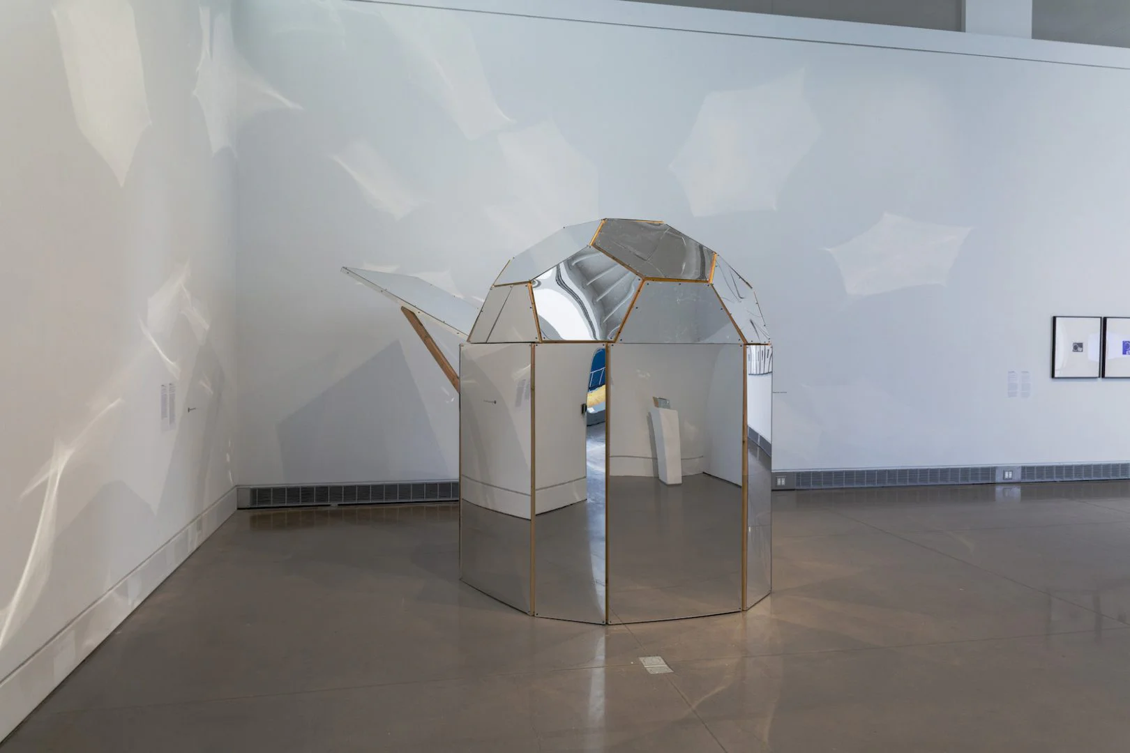 Beatriz Cortez, The Cosmos (Spaceship), 2015. Wood, acrylic mirror, sound installation. Installation view at the Queens Museum, New York. Courtesy of the artist and Commonwealth and Council. Photo: Hai Zhang. 