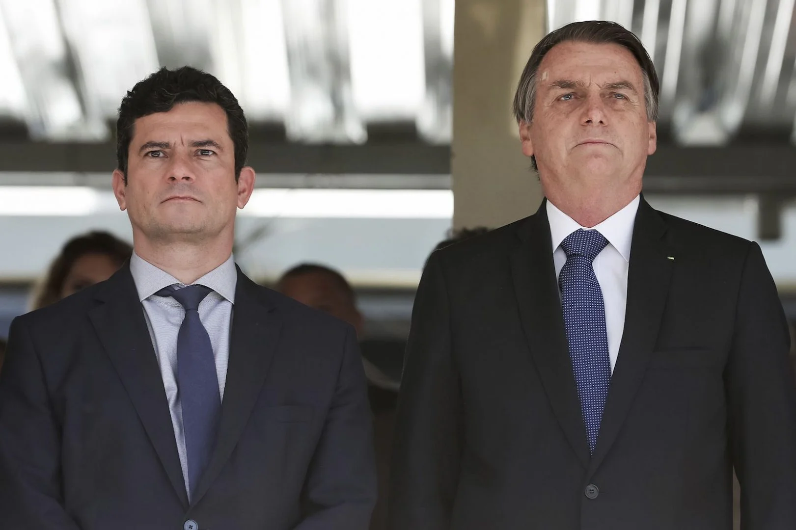 Brazil's President Jair Bolsonaro, right, and Justice Minister Sergio Moro attend a military ceremony in Brasilia, Brazil, 2019.  (Marcos Correa/Brazil's Presidential Press Office via AP)
