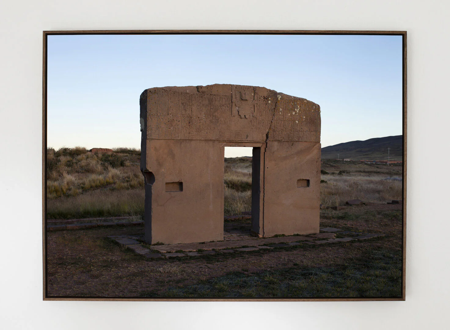 GØNEJA ✷ 5 Gate of the Sun (2022), inkjet print on plate, shadow-box frame, 77 x 106 x 5 cm | The mysterious monolithic gateway standing in the ancient archaeological site of Tiwanaku in Bolivia.